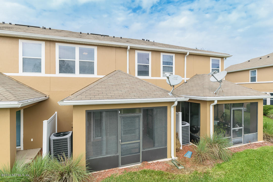 12991 Spring Rain Road Jacksonville, FL 32258 - Photo 17 of 23 a front view of a house with garden