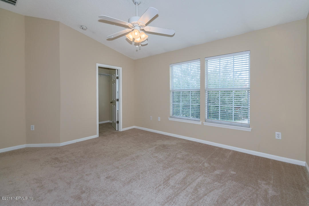 12991 Spring Rain Road Jacksonville, FL 32258 - Photo 4 of 23 a view of an empty room with a window