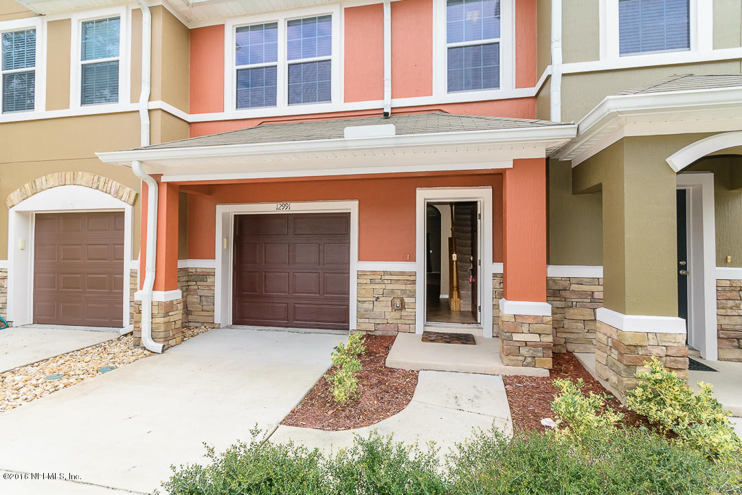 12991 Spring Rain Road Jacksonville, FL 32258 - Photo 6 of 23 a front view of a house with a yard