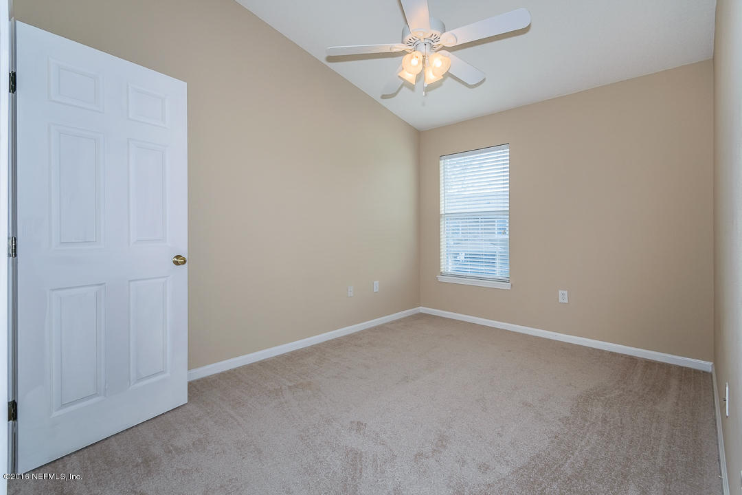 12991 Spring Rain Road Jacksonville, FL 32258 - Photo 8 of 23 a view of an empty room with a window