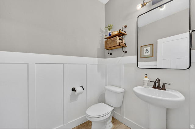 14714 South Bright Wood Road Herriman, UT 84096 - Photo 16 of 41 Half bathroom with a wainscoted wall and a decorative wall