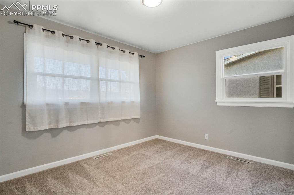 1901 Ridgewood Lane Pueblo, CO 81005 - Photo 14 of 29 a view of an empty room with a window