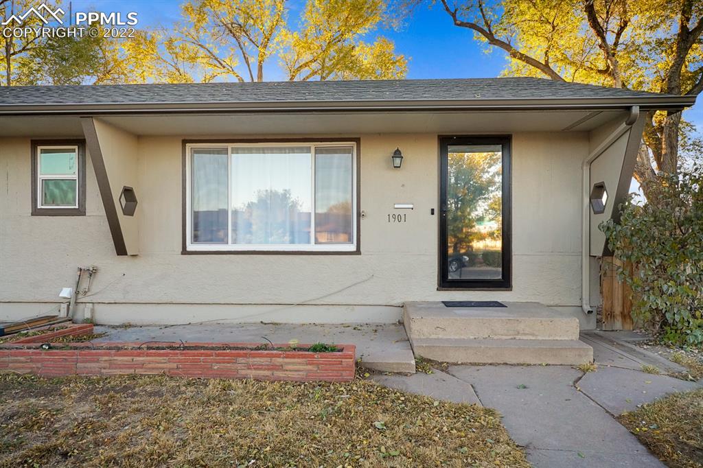 1901 Ridgewood Lane Pueblo, CO 81005 - Photo 2 of 29 a front view of a house with a yard