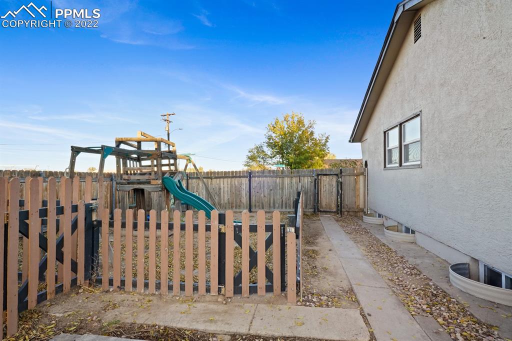 1901 Ridgewood Lane Pueblo, CO 81005 - Photo 23 of 29 a view of a house with wooden fence