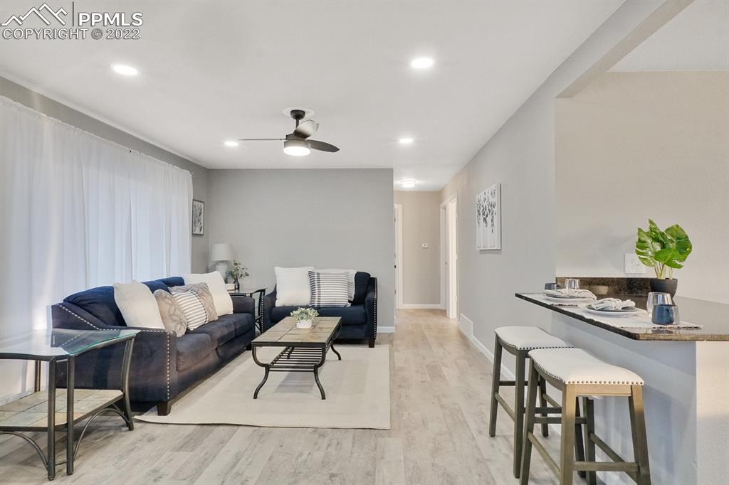 1901 Ridgewood Lane Pueblo, CO 81005 - Photo 4 of 29 a living room with furniture and a potted plant