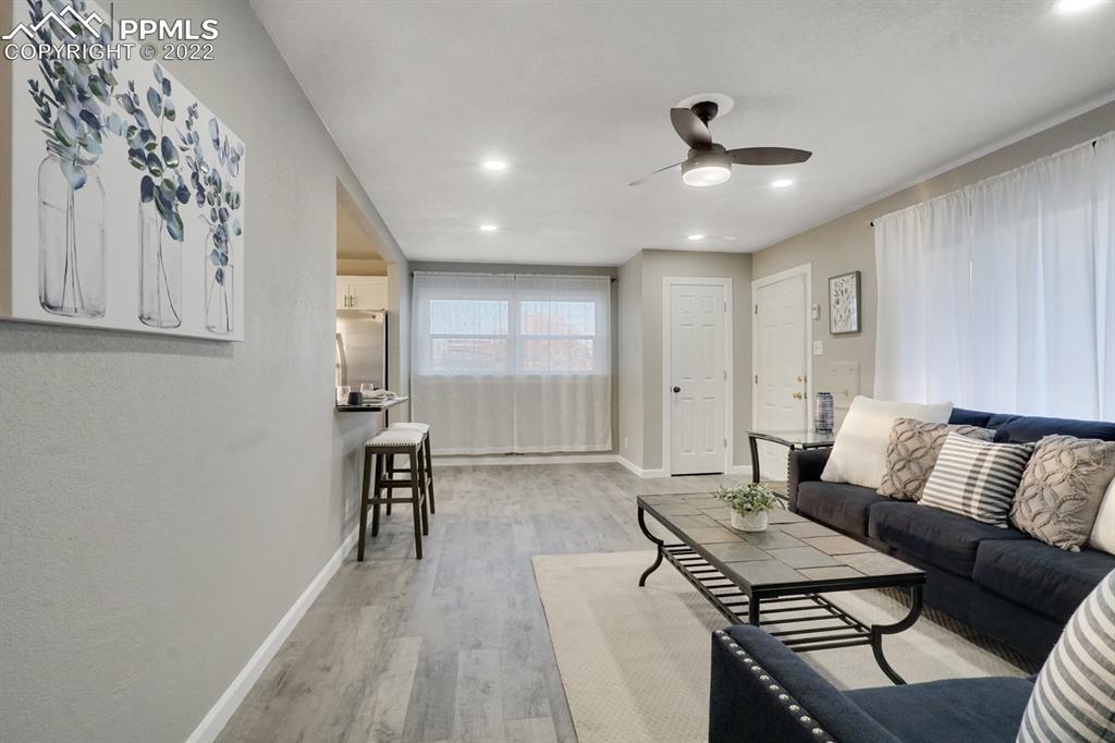 1901 Ridgewood Lane Pueblo, CO 81005 - Photo 6 of 29 a living room with furniture and wooden floor