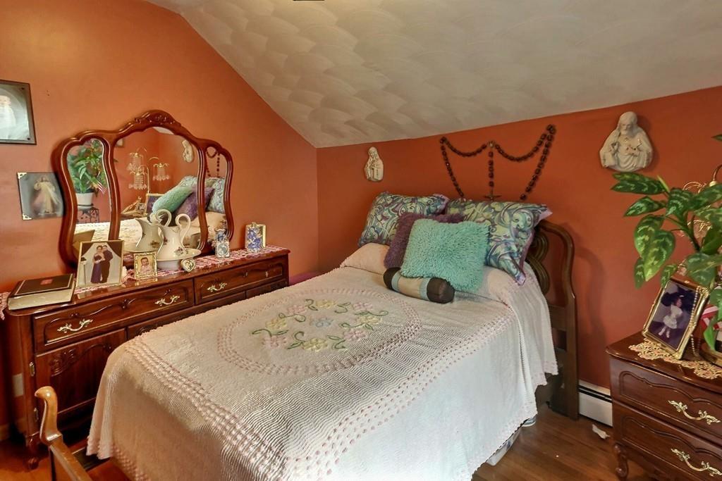 52 Smith Street Fall River, MA 02721 - Photo 7 of 13 a bedroom with a bed and dresser with mirror