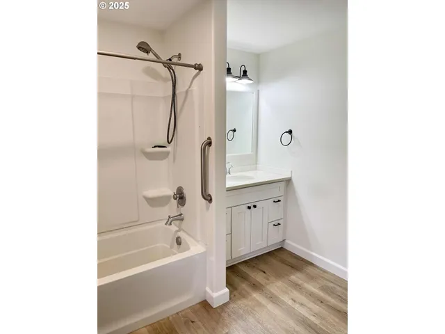 a bedroom with a bed and a mirror