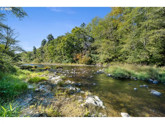 a view of a chairs and table on the wooden deck