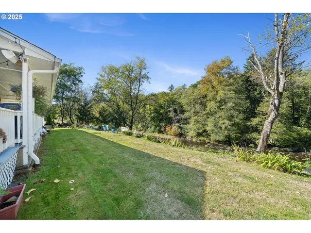 a view of a patio with table and chairs