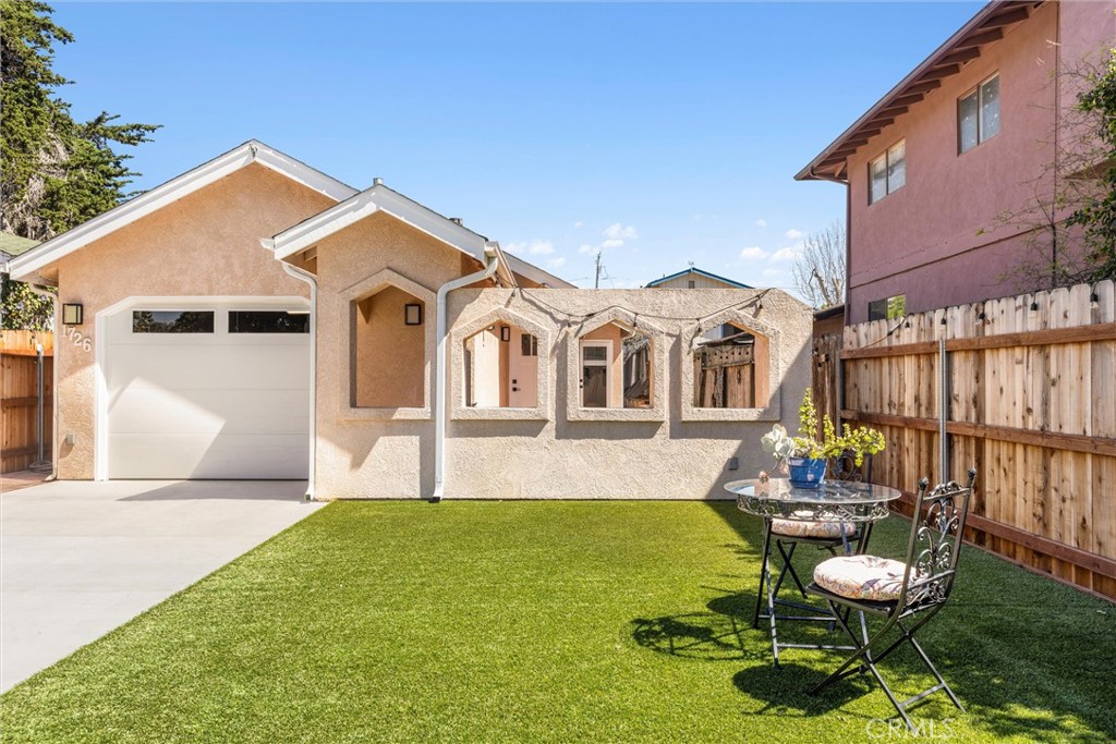 1726 7th Street Los Osos, CA 93402 - Photo 1 of 1 a front view of a house with garden