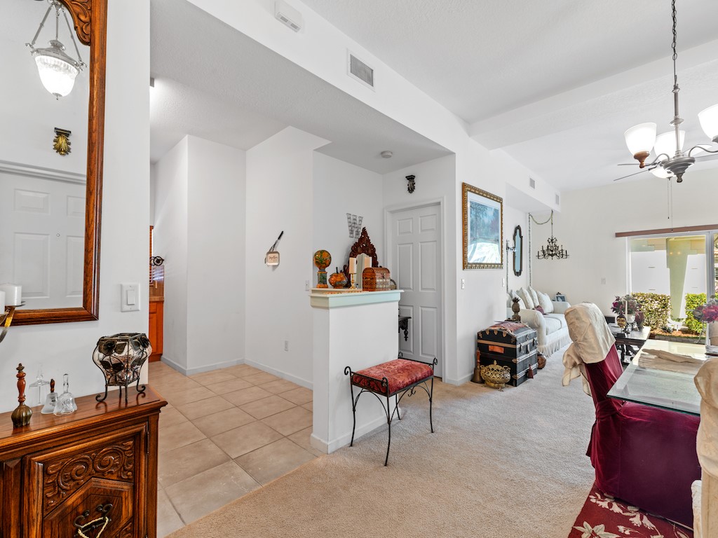 572 7th Square Southwest, Unit 101 Vero Beach, FL 32962 - Photo 11 of 34 a living room with furniture a rug and a window