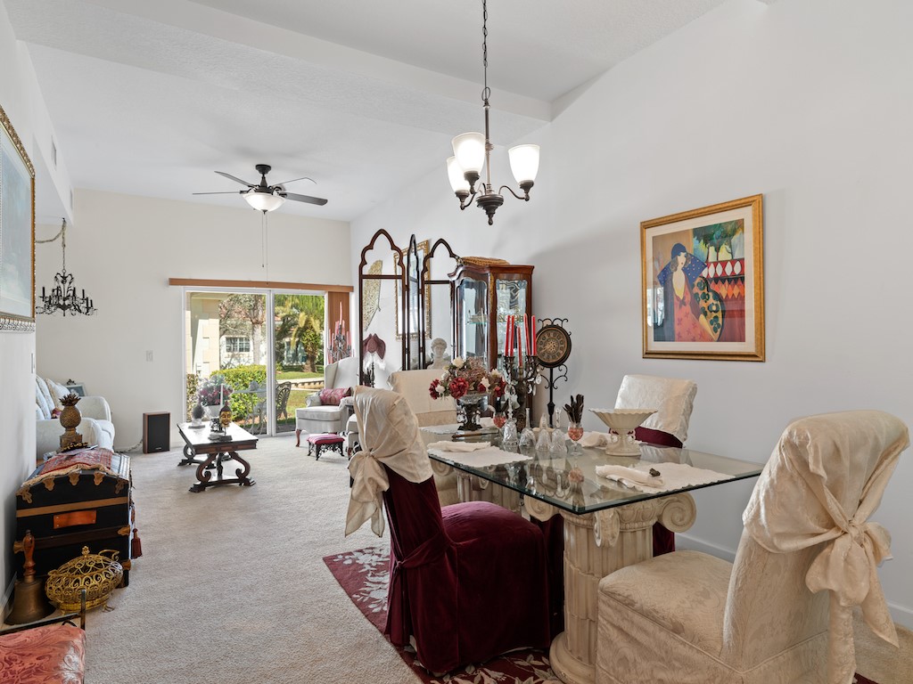 572 7th Square Southwest, Unit 101 Vero Beach, FL 32962 - Photo 15 of 34 a living room with furniture chandelier and a chandelier