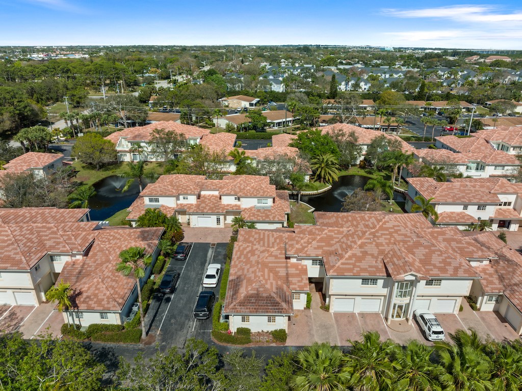 572 7th Square Southwest, Unit 101 Vero Beach, FL 32962 - Photo 27 of 34 an aerial view of residential houses with outdoor space