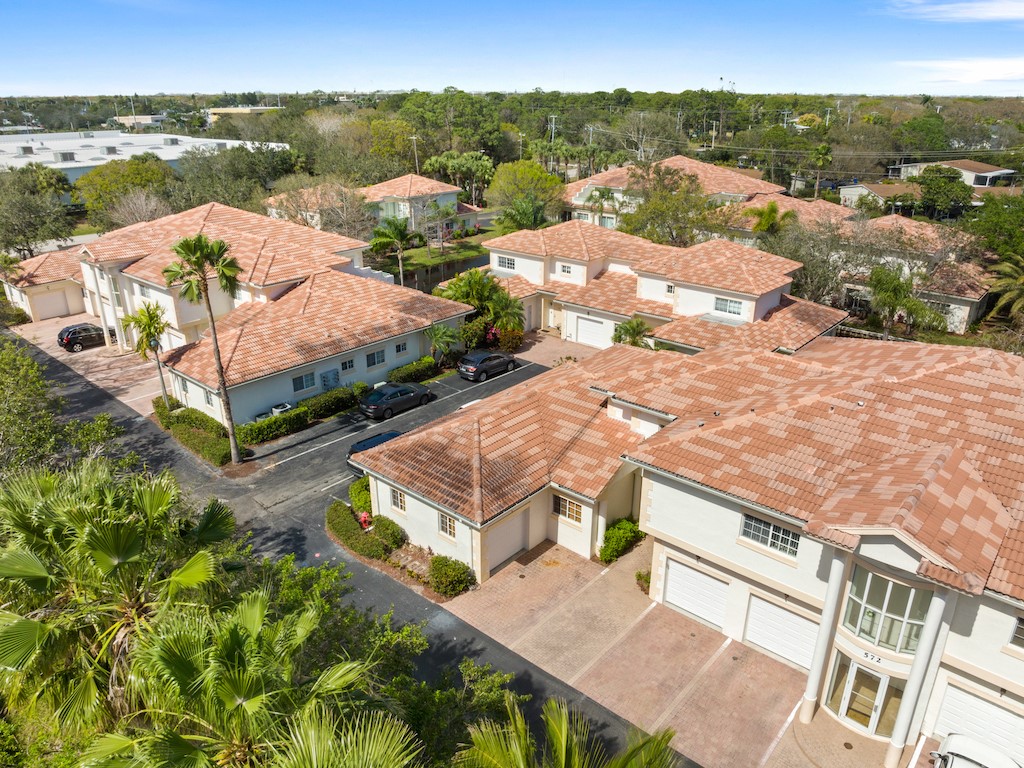 572 7th Square Southwest, Unit 101 Vero Beach, FL 32962 - Photo 28 of 34 a view of a terrace with wooden floor and lake view