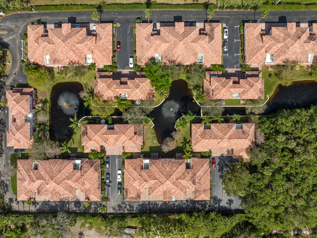 572 7th Square Southwest, Unit 101 Vero Beach, FL 32962 - Photo 29 of 34 an aerial view of residential houses with outdoor space and swimming pool