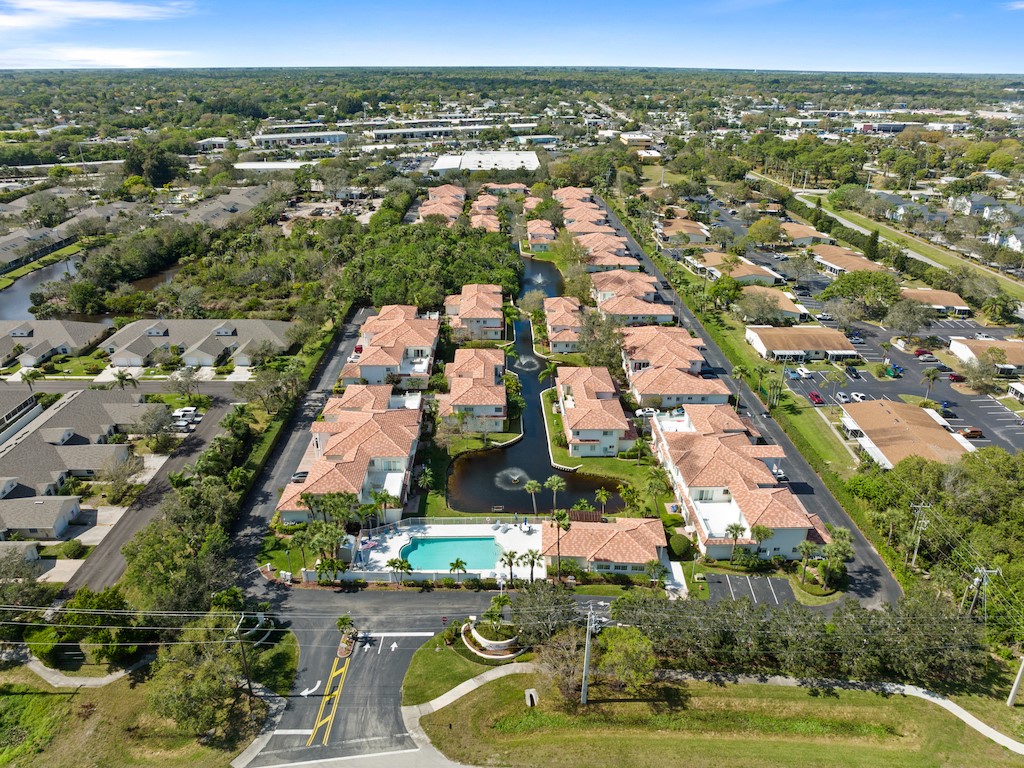 572 7th Square Southwest, Unit 101 Vero Beach, FL 32962 - Photo 31 of 34 an aerial view of residential houses with outdoor space