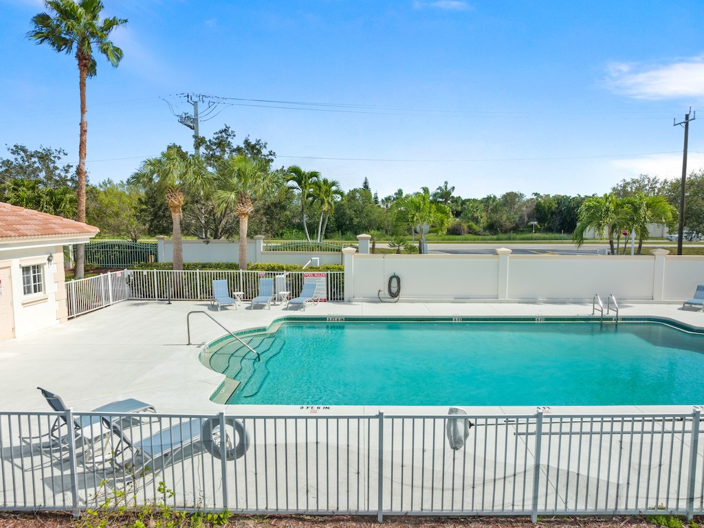 572 7th Square Southwest, Unit 101 Vero Beach, FL 32962 - Photo 32 of 34 a view of a house with a yard