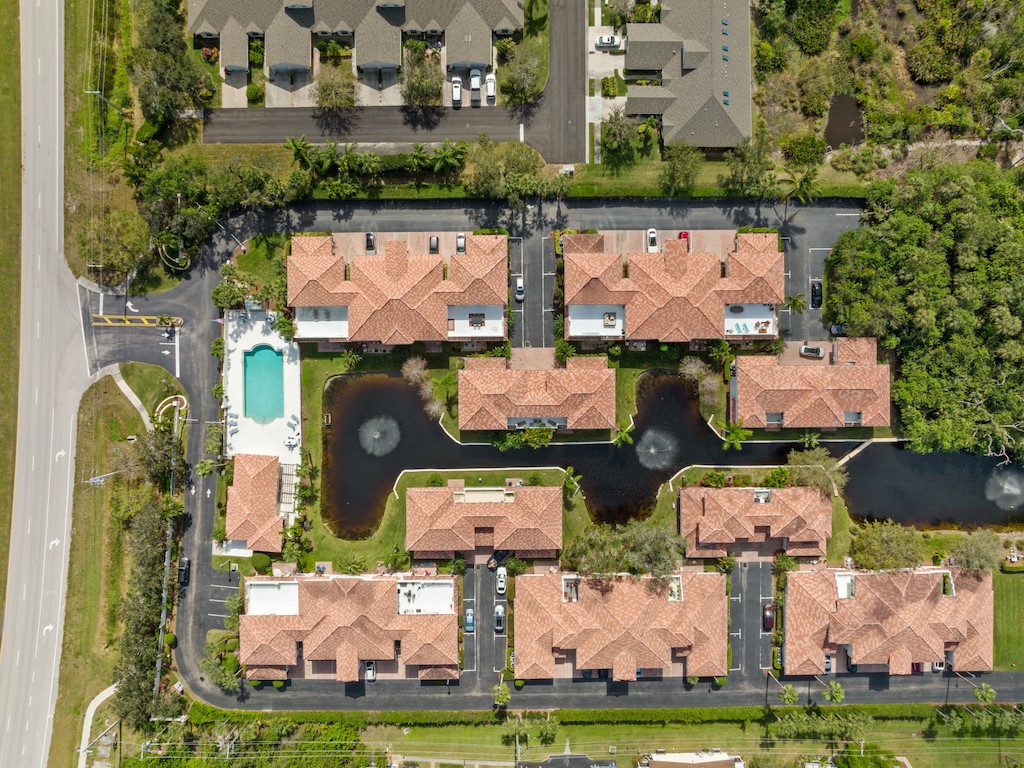 572 7th Square Southwest, Unit 101 Vero Beach, FL 32962 - Photo 34 of 34 an aerial view of houses with yard
