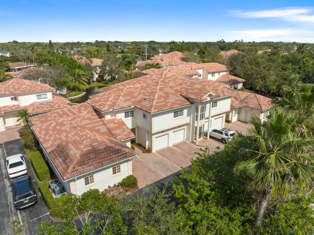 572 7th Square Southwest, Unit 101 Vero Beach, FL 32962 - Photo 4 of 34 an aerial view of a house with a garden