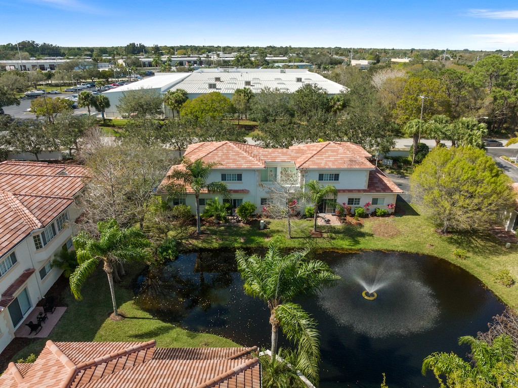 572 7th Square Southwest, Unit 101 Vero Beach, FL 32962 - Photo 5 of 34 a view of a lake with a mountain in the background