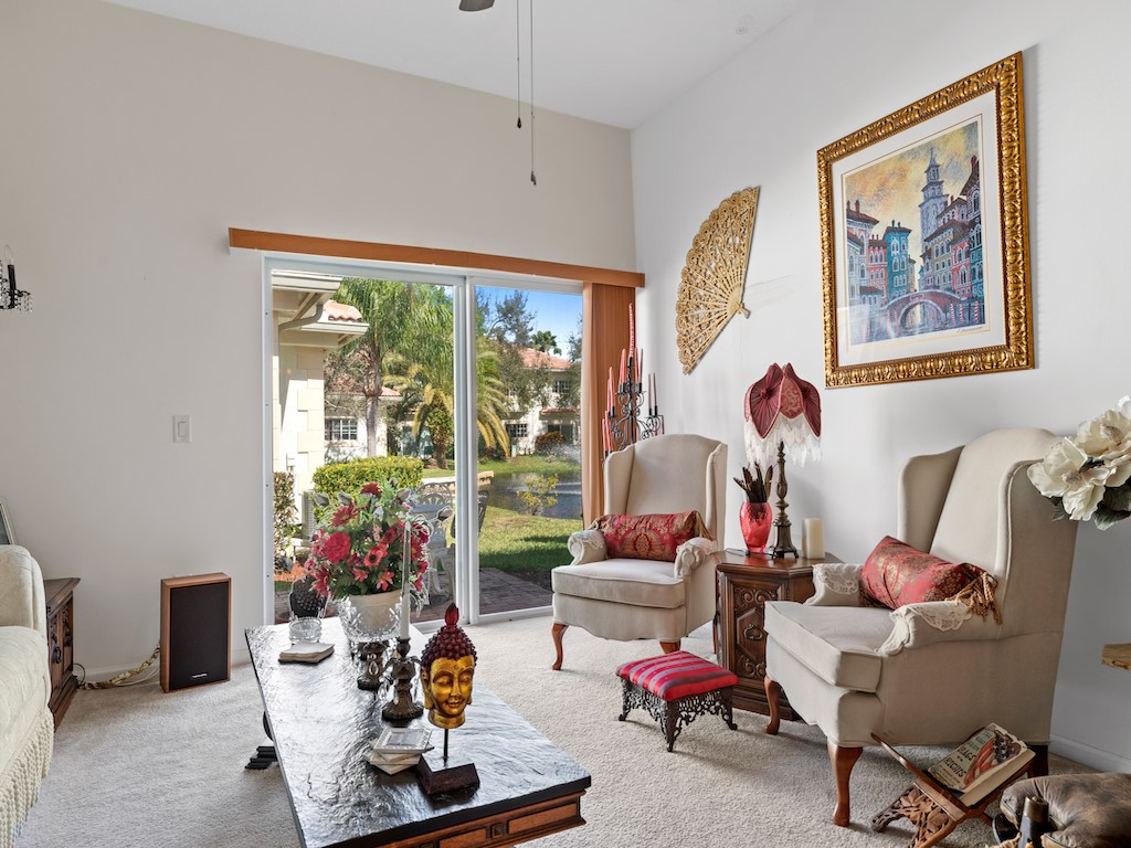 572 7th Square Southwest, Unit 101 Vero Beach, FL 32962 - Photo 6 of 34 a living room with furniture and a large window