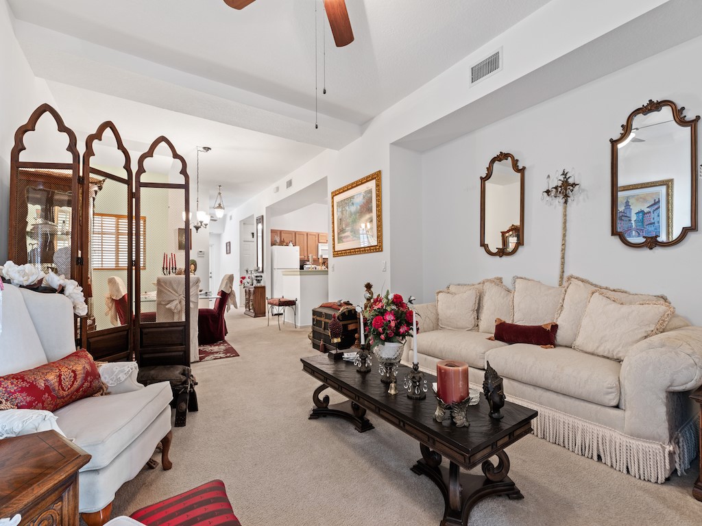 572 7th Square Southwest, Unit 101 Vero Beach, FL 32962 - Photo 7 of 34 a living room with patio furniture and wooden floor