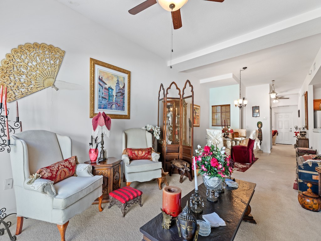 572 7th Square Southwest, Unit 101 Vero Beach, FL 32962 - Photo 8 of 34 a living room with lots of furniture and a chandelier
