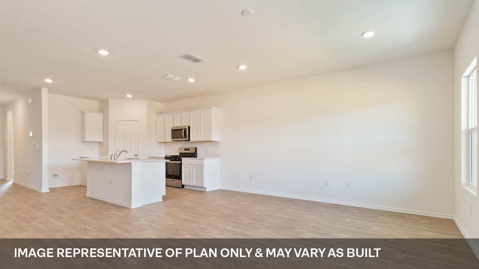 214 Balmorhea Street Kyle, TX 78640 - Photo 5 of 19 a view of kitchen with microwave and stove