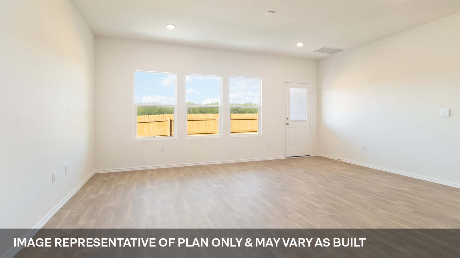 214 Balmorhea Street Kyle, TX 78640 - Photo 9 of 19 an empty room with wooden floor and windows