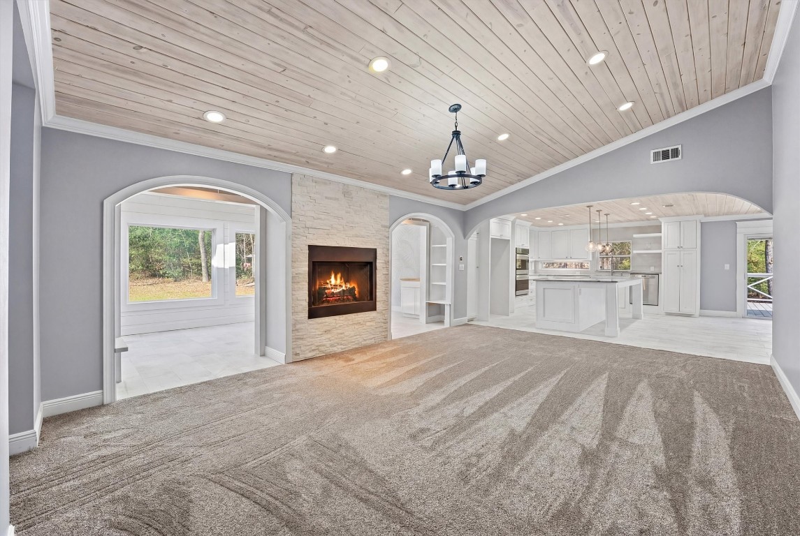 a view of an empty room and fire place