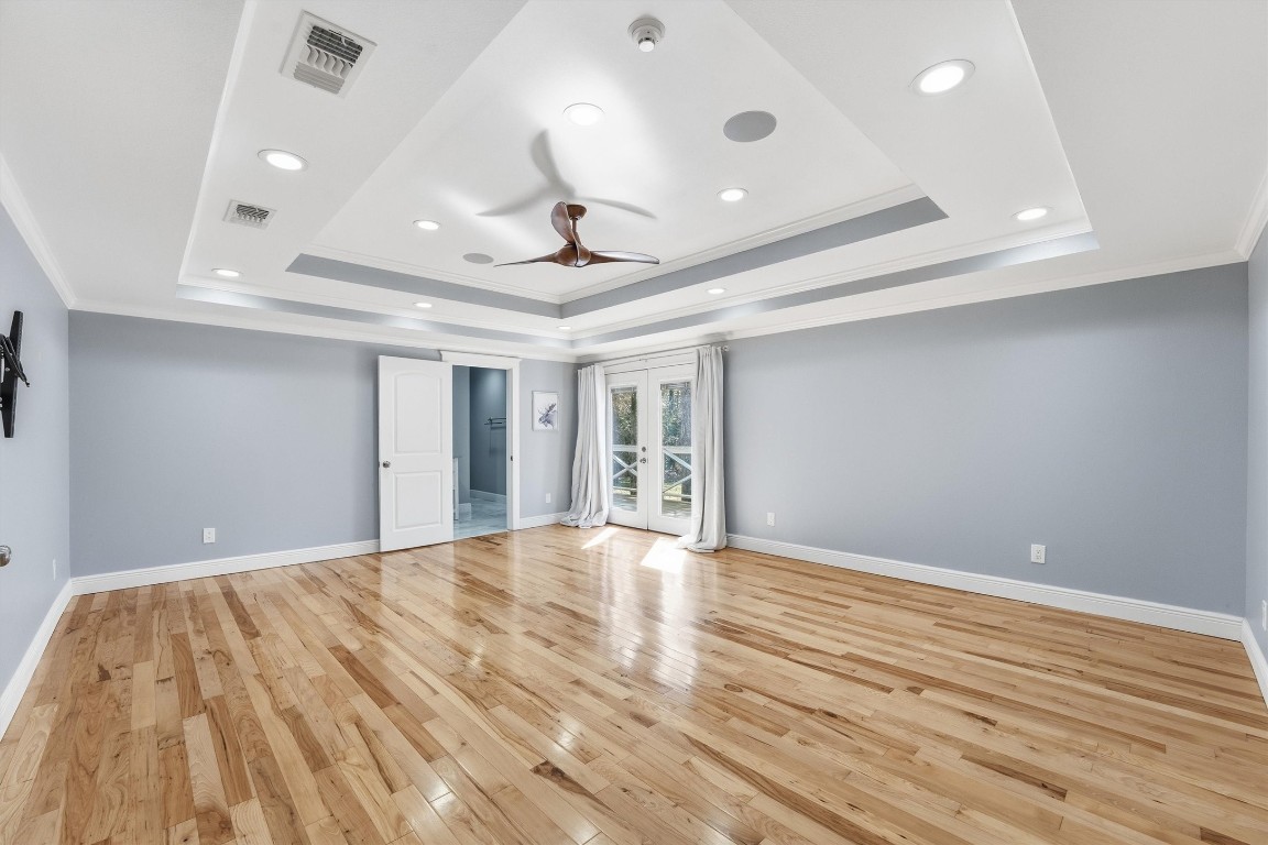 2920 Superior Road Magnolia, TX 77354 - Photo 19 of 49 a view of an empty room with wooden floor and a window