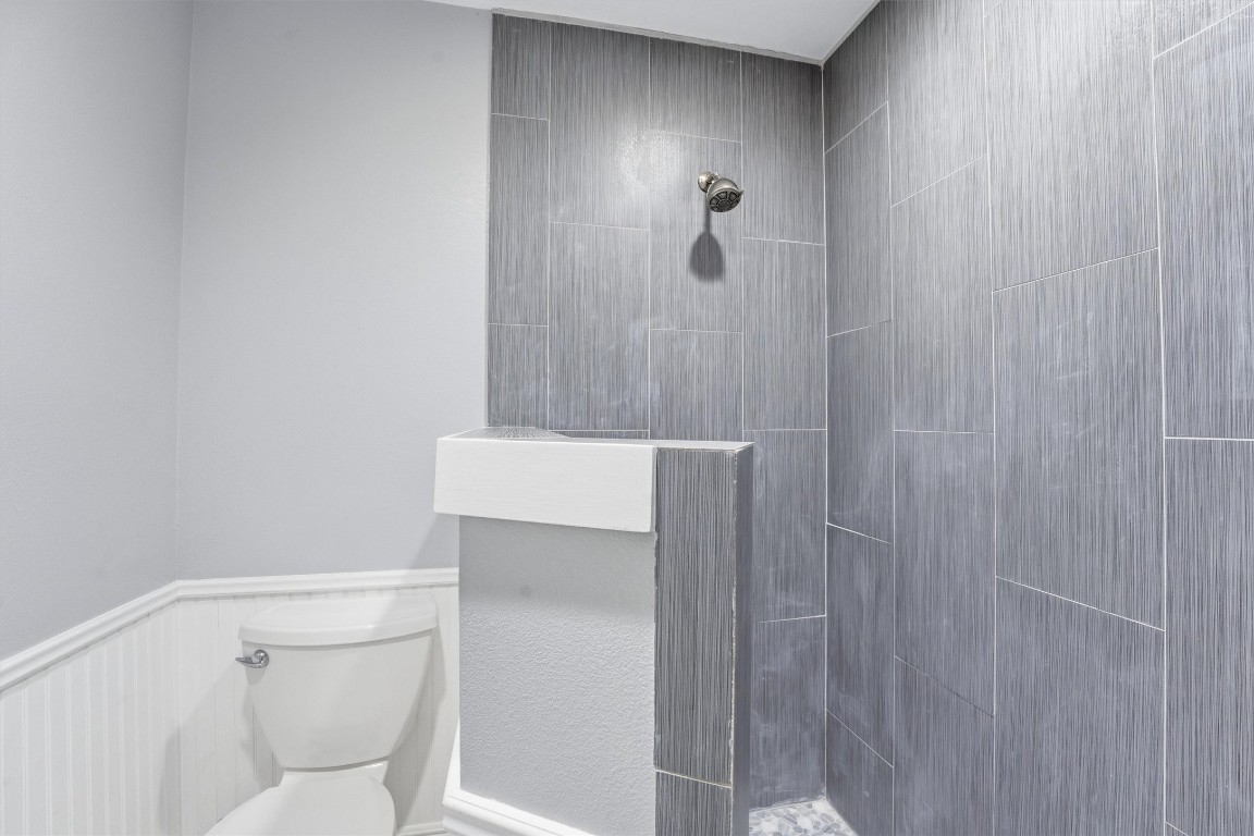 2920 Superior Road Magnolia, TX 77354 - Photo 30 of 49 a bathroom with a toilet and a shower