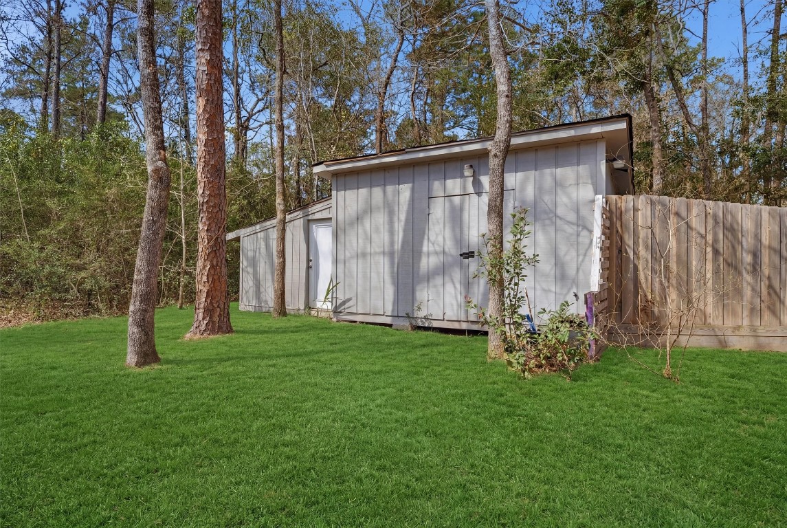 2920 Superior Road Magnolia, TX 77354 - Photo 45 of 49 a backyard of a house with lots of green space