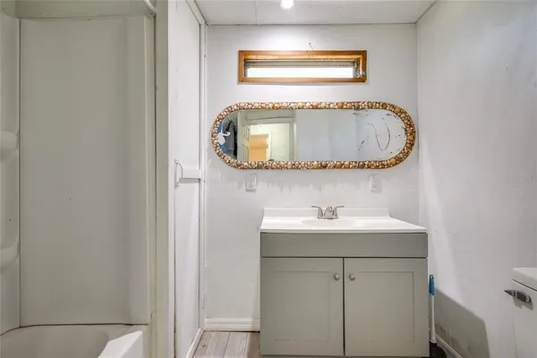 a bathroom with a sink and a mirror