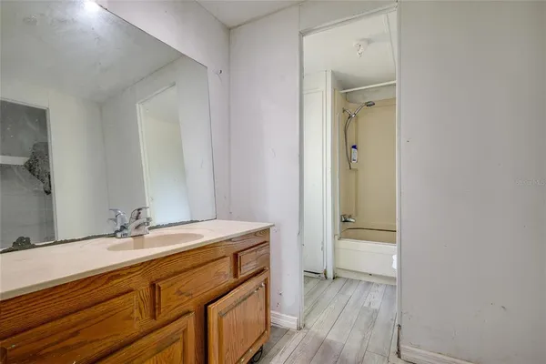 a bathroom with a sink a mirror and a toilet