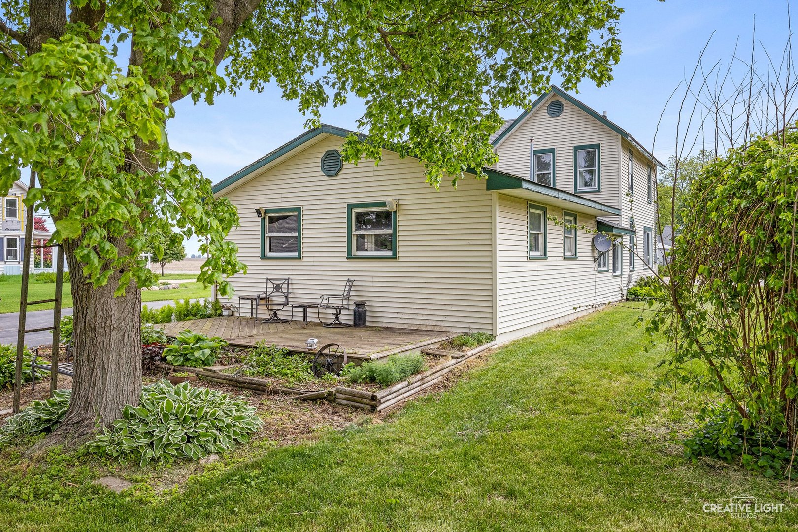 209 North Shabbona Road Shabbona, IL 60550 - Photo 22 of 25 a house view with a garden space