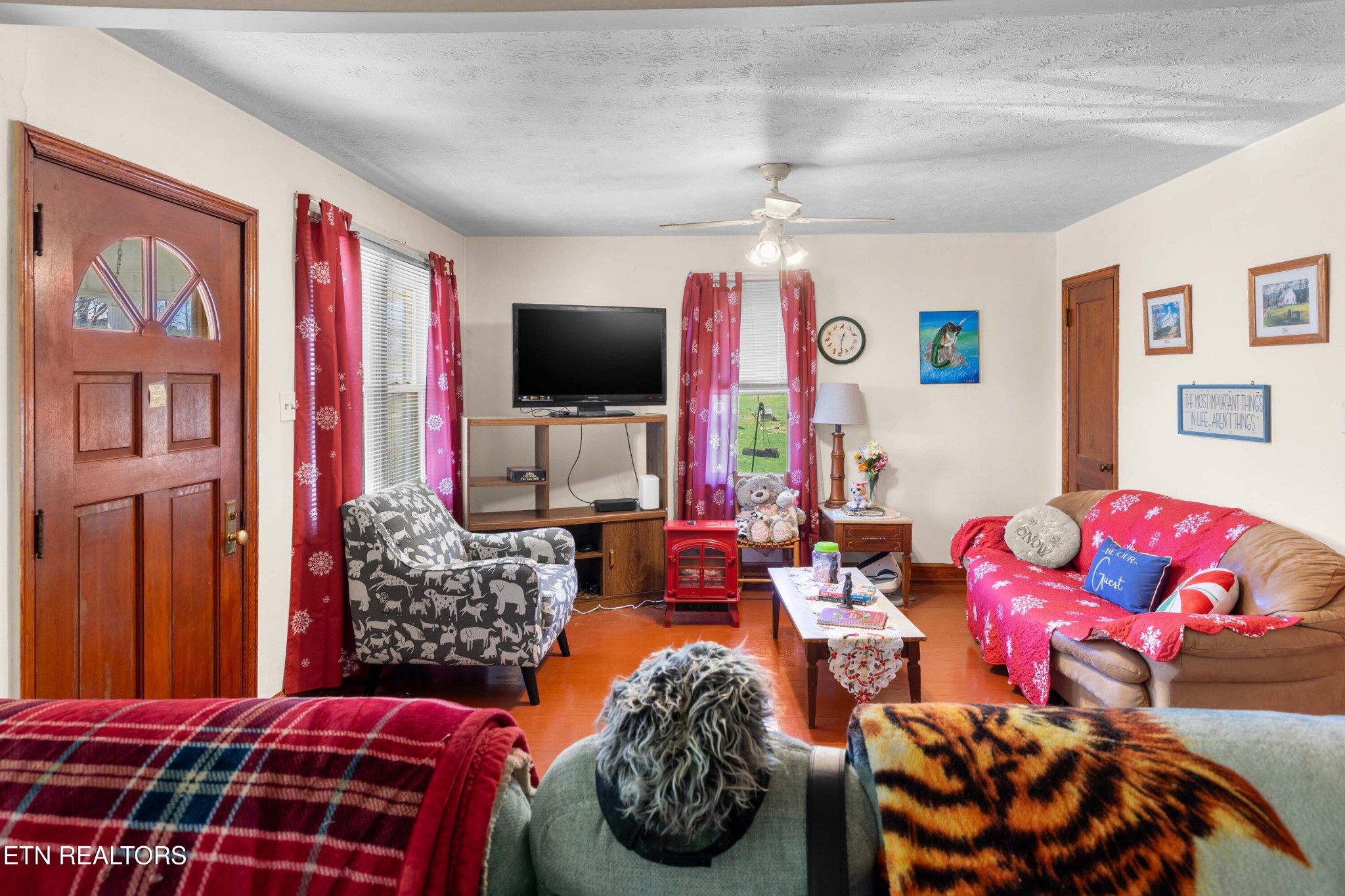385 Hubbs Grove Road Maynardville, TN 37807 - Photo 6 of 33 a bedroom with furniture and a flat screen tv