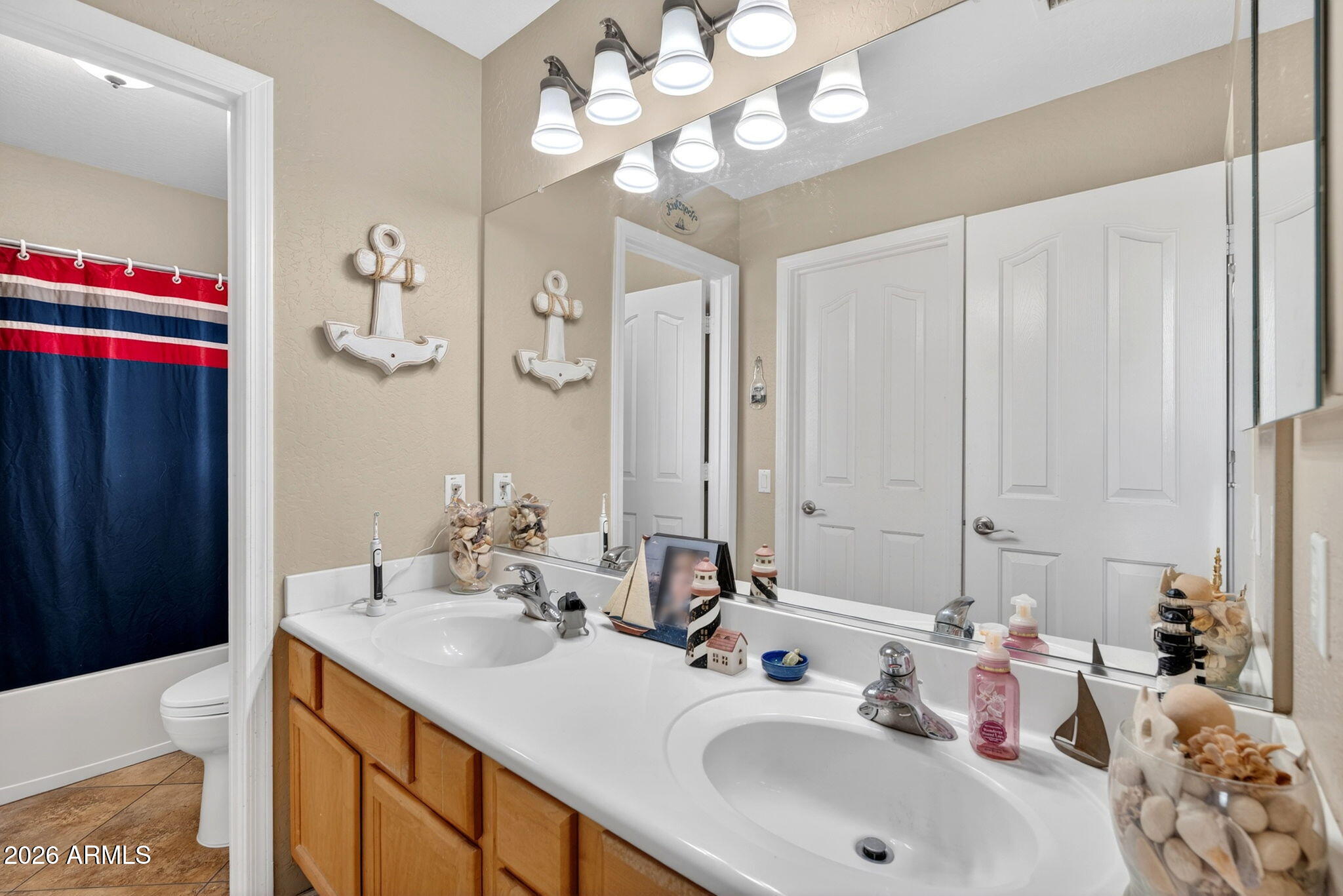 6280 South Sinova Court Gilbert, AZ 85298 - Photo 46 of 64 a bathroom with a sink double vanity and a mirror