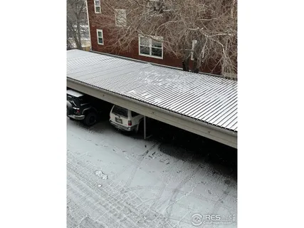 a view of a building with a snow in the background