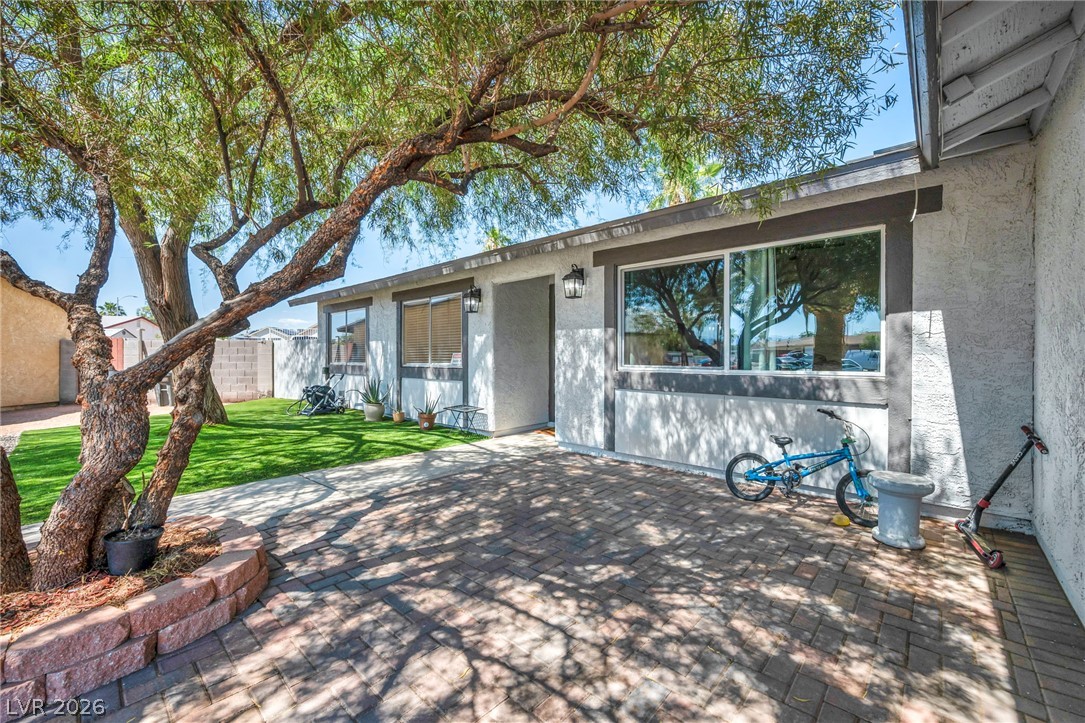 5882 Rio Tinto Way Las Vegas, NV 89110 - Photo 7 of 56 A welcoming brick paver entry shaded by a mature tree leads to this charming residence.