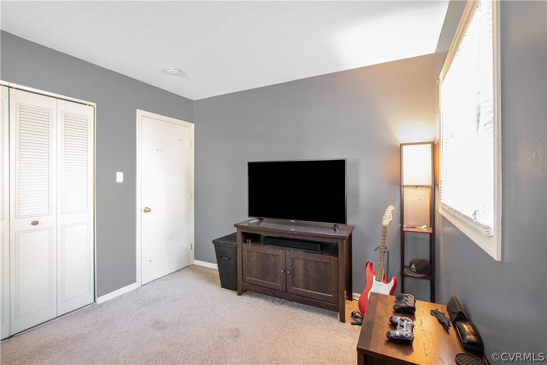 10313 Ridgerun Road Chesterfield, VA 23832 - Photo 7 of 22 a room with furniture and flat screen tv