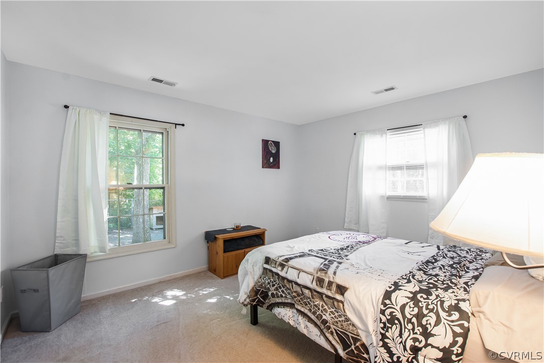 10313 Ridgerun Road Chesterfield, VA 23832 - Photo 8 of 22 a bedroom with a bed and a window