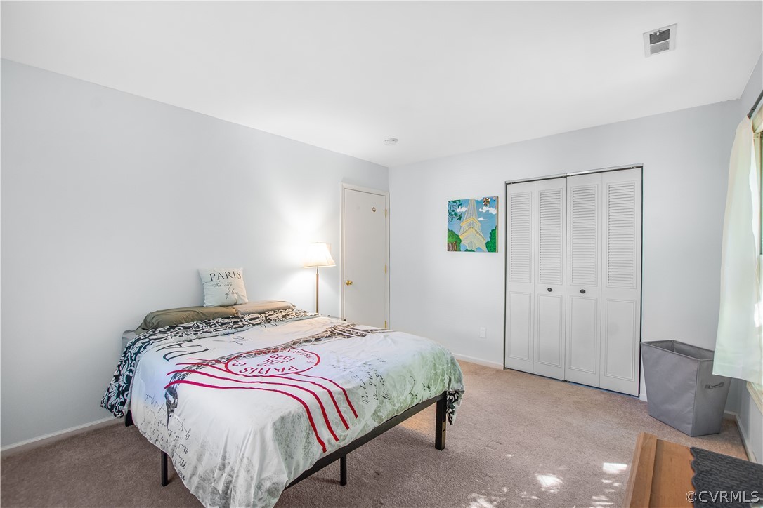 10313 Ridgerun Road Chesterfield, VA 23832 - Photo 9 of 22 a bedroom with a bed and a window