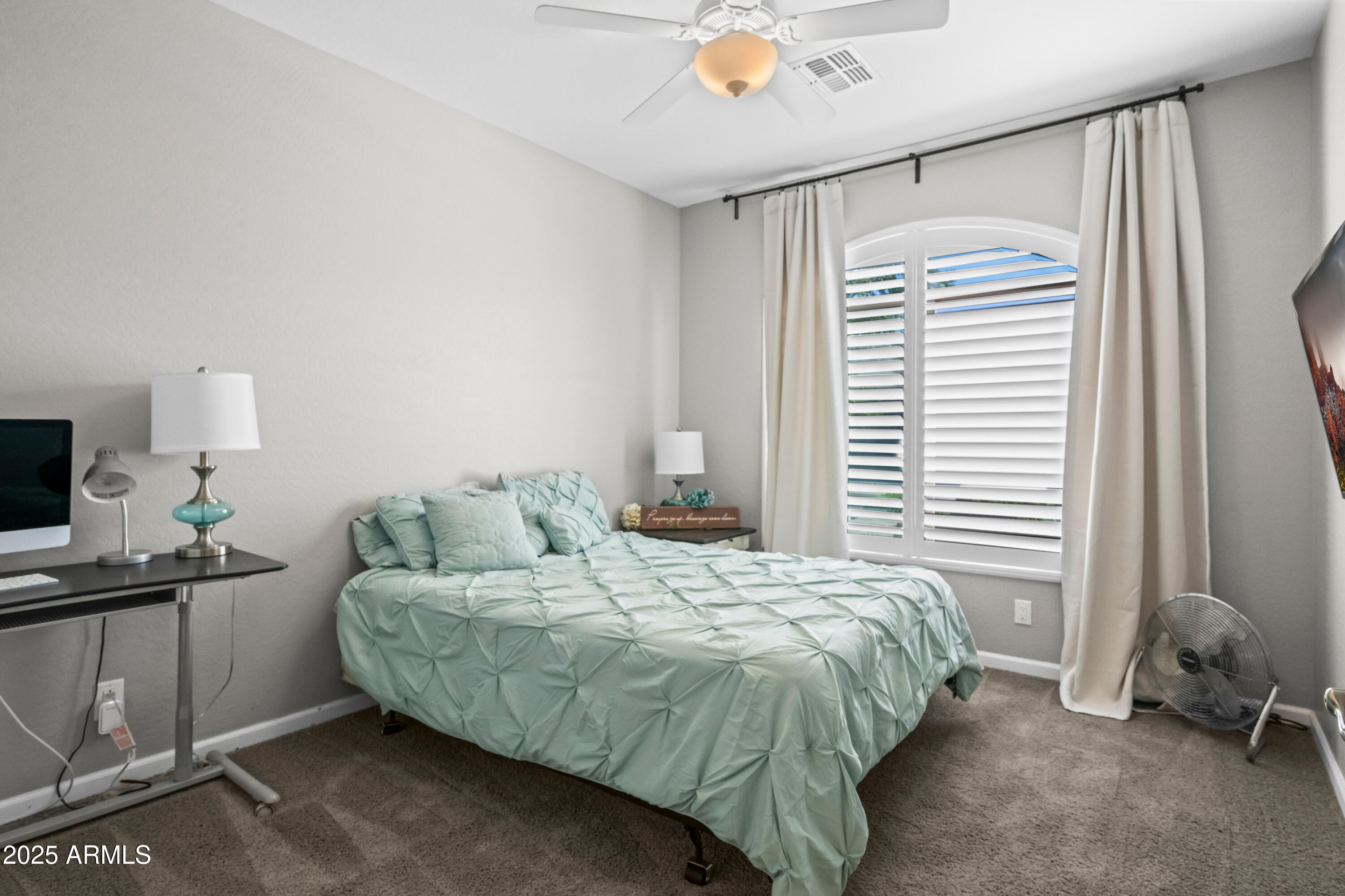 3117 South Signal Butte Road, Unit 474 Mesa, AZ 85212 - Photo 18 of 24 a bedroom with a bed and a window