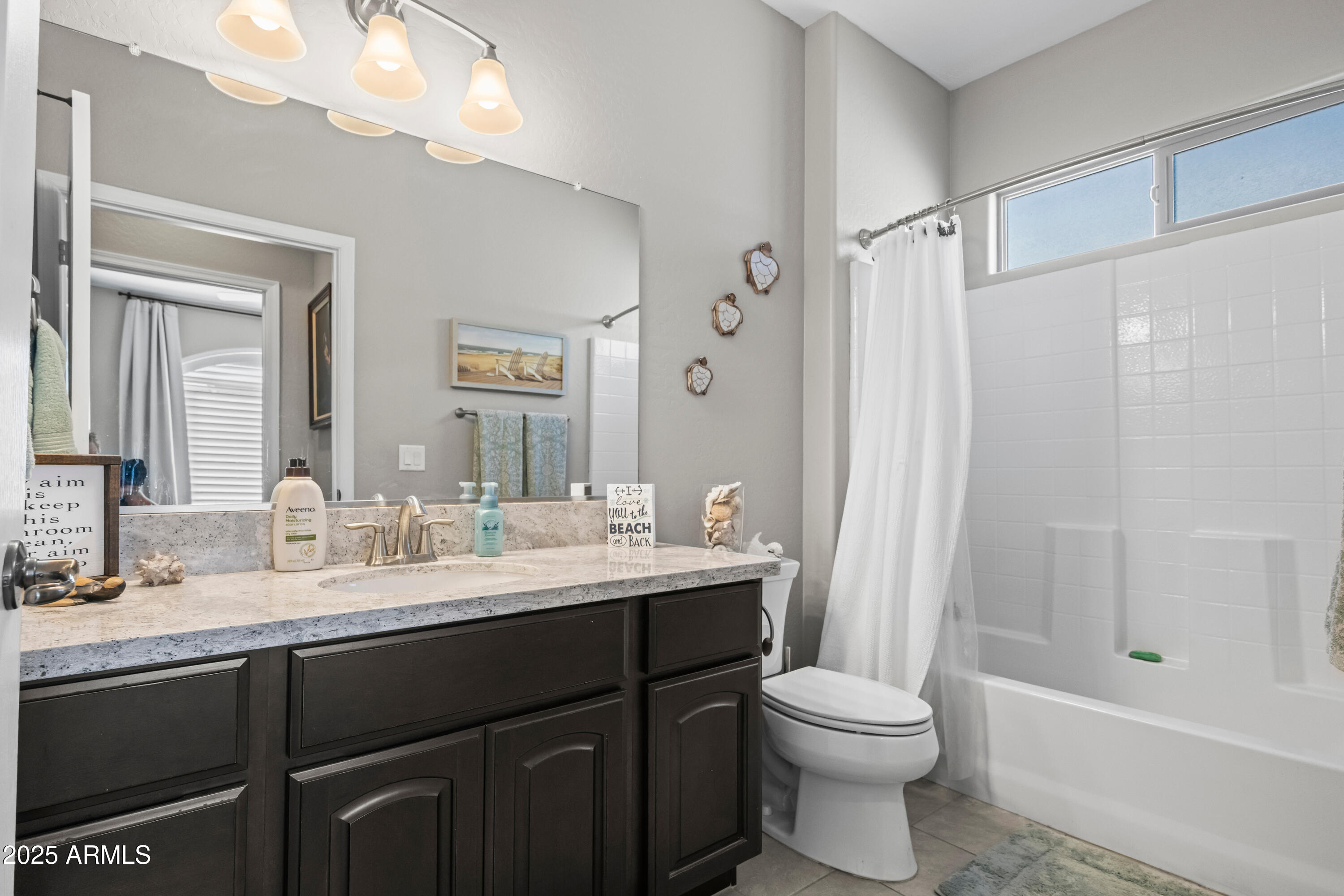 3117 South Signal Butte Road, Unit 474 Mesa, AZ 85212 - Photo 20 of 24 a bathroom with a sink a toilet and shower