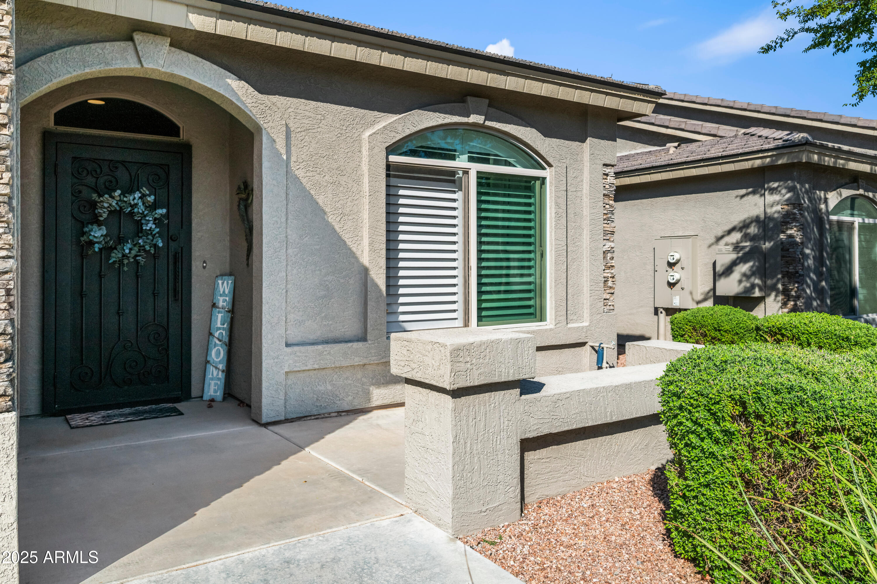 3117 South Signal Butte Road, Unit 474 Mesa, AZ 85212 - Photo 2 of 24 a front view of a house with entryway