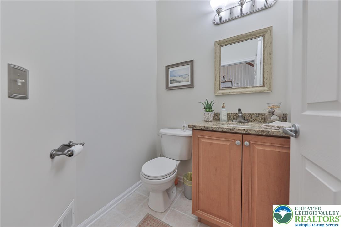 163 Muirfield Way Easton, PA 18042 - Photo 15 of 48 a bathroom with a granite countertop toilet sink and mirror