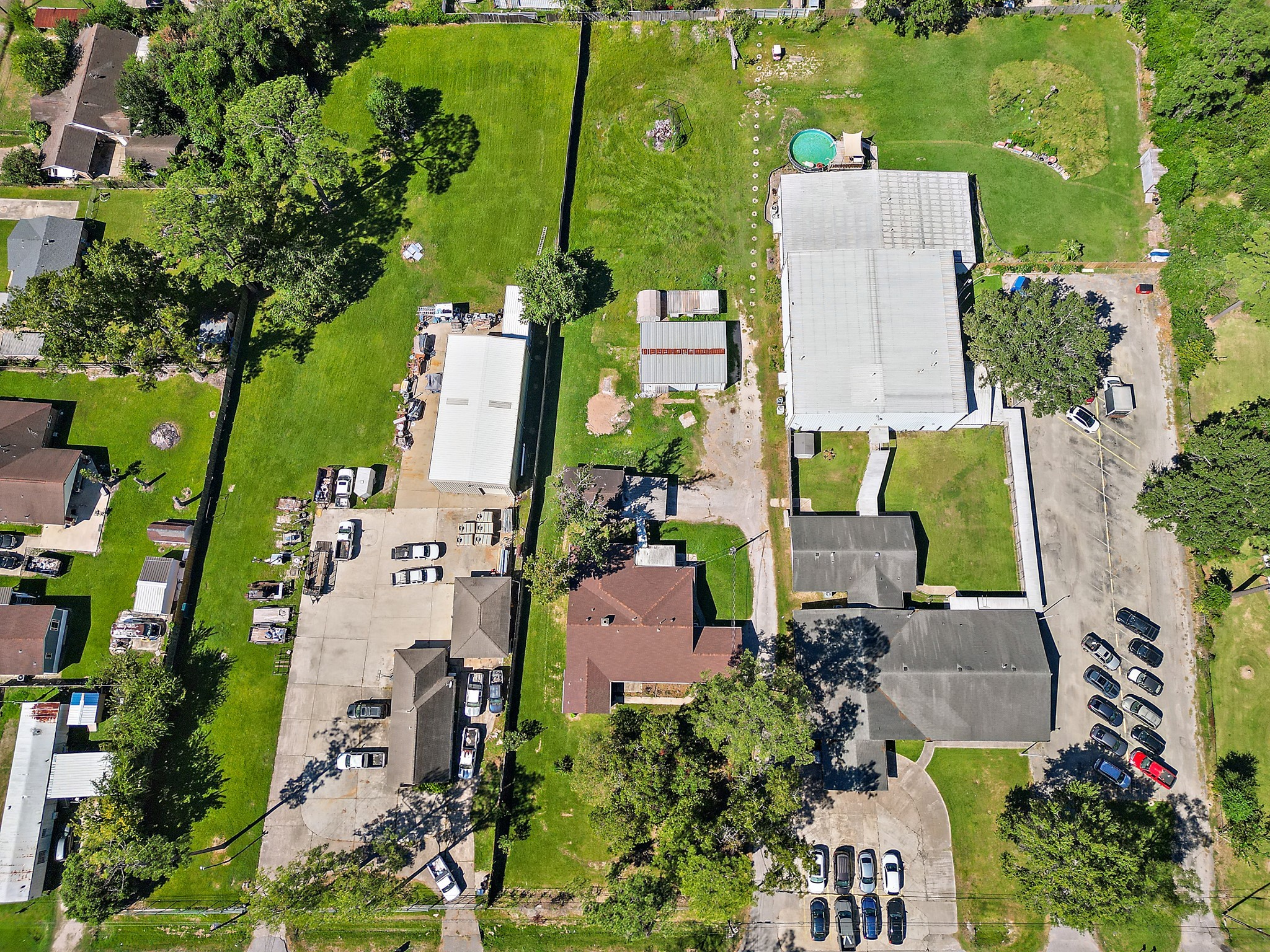 an aerial view of residential house with outdoor space and swimming pool