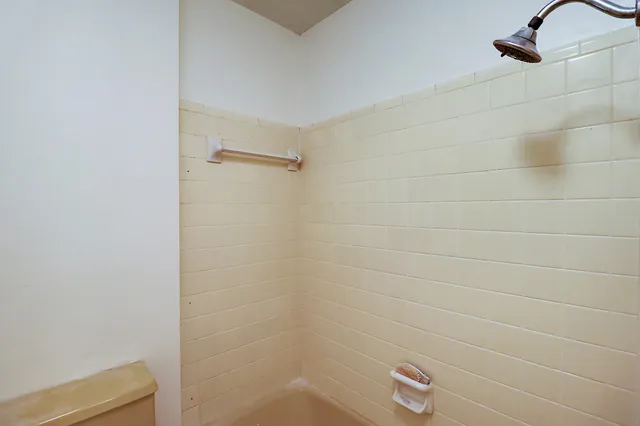 a bathroom with a sink and shower